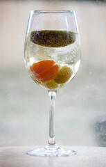 Champagne with fruit in a wine glass 