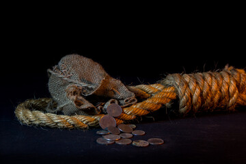 30 silver coins and a gallows, symbols of the betrayal of Judas