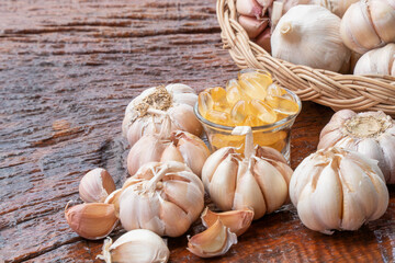 Garlic oil capsules in transparent glass.