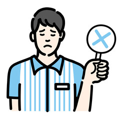 バツの札を持って残念そうなコンビニ店員の若い男性
