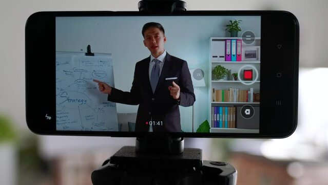 Coach manager instructor lecturer speaker business person entrepreneur doing work presentation pitching online when working from home in improper suit half dressed shorts.