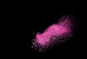 Pink powder explosion isolated on black background