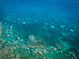 Fototapeta na wymiar Sea surface with small waves, top view in blue and turquoise color tones