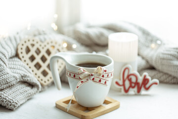 Festive composition with a cup and decor details for Valentine's Day.