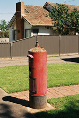Fototapeta na wymiar Old Red Post Box rusted