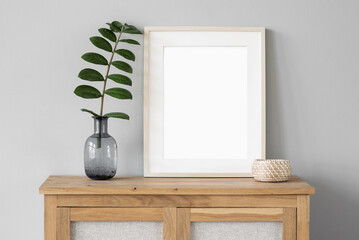Blank picture frame mockup on white wall. Template for painting or poster. White living room...