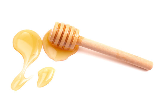 A Honey Spoon and Honey on a White Background