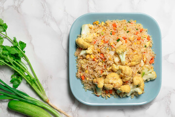 Fried rice with vegetable and egg in plate on white background.