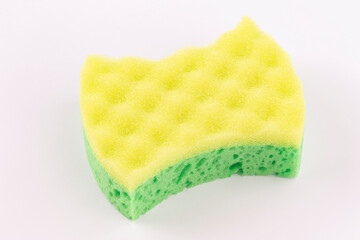 Yellow- green sponge for washing dishes close-up