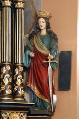 Saint Catherine of Alexandria, statue on the altar of Our Lady of Sorrows in the church of St. Clare of Assisi in Zagreb, Croatia - obrazy, fototapety, plakaty