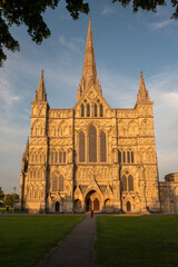 Fototapeta na wymiar West façade of Salisbury Cathedral, Wiltshire, against a clear blue sky. July 2021