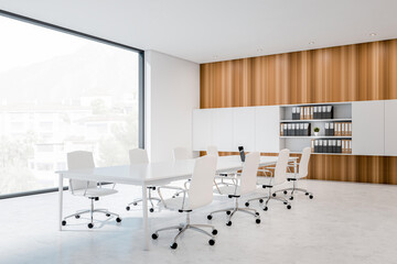 Corner view on bright office room interior with panoramic window