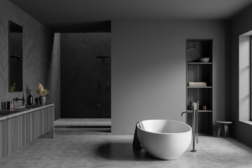 Grey bathroom interior with shower and bathtub, rack with decoration