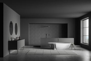 Fototapeta na wymiar Dark bathroom interior with bathtub, shower tiled area, double sink, panoramic window with park view, grey walls, concrete floor. Concept of hygienic and spa procedures for health. 3d rendering