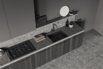 Top view of dark kitchen set interior with sink, kitchenware