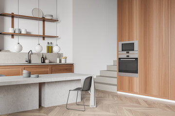 Top view of light kitchen interior with table and stairs, kitchenware