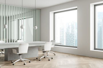 Office room interior with seats, table and panoramic window with city view
