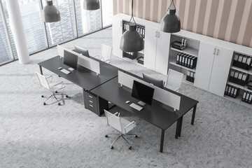 Top view office room interior with desks with desktop computers, armchairs, panoramic windows, closet with folders and concrete floor. Concept of place for working process and coworking. 3d rendering