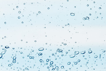 Fototapeta na wymiar Liquid gel texture. Cosmetic serum, toner, water macro with bubbles. Blue transparent skincare product background