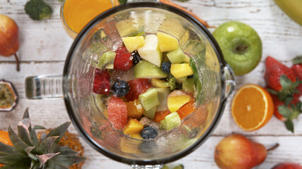 Fresh fruit and vegetables smoothie blended in blender, top view. Healthy eating concept.