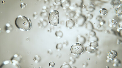 Moving Bubbles on Light Background, macro shot.