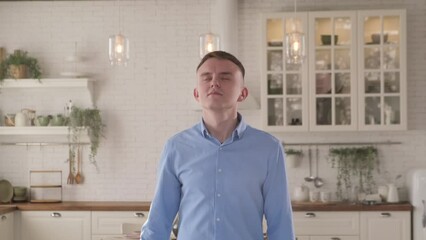 Man applying air freshener at home