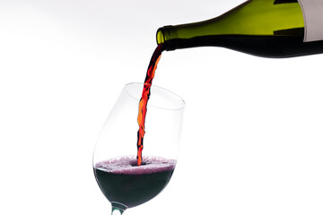 Glass getting wine poured from a bottle