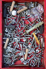 screws, nails, bolts, dowels, plugs, wood screws, metal screws. box with tools, handmade, repair.