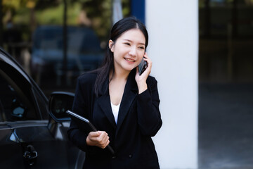 Asian businessmen, business owners, company presidents or female employees talking on the phone and...