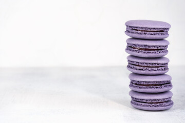 Macaroons are delicious french cookies. Purple macaroons. A great gift idea for 8 March - International Women's Day. Copy space. Selective focus