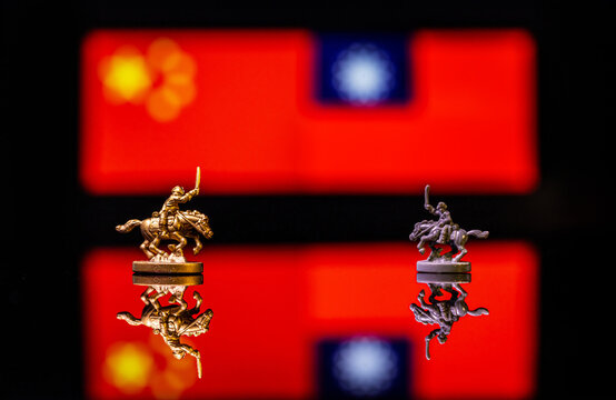 Conceptual image of war between China and Taiwan using toy soldiers and national flags