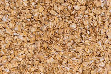 Oatmeal in a spoon.
Healthy oatmeal.
Scattered oatmeal on the table.