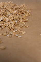 Oatmeal in a spoon.
Healthy oatmeal.
Scattered oatmeal on the table.