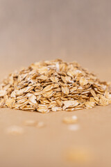 Oatmeal in a spoon.
Healthy oatmeal.
Scattered oatmeal on the table.