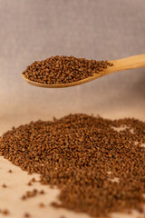 Buckwheat in a spoon.
Scattered buckwheat.