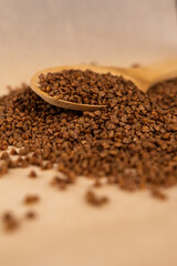 Buckwheat in a spoon.
Scattered buckwheat.