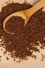 Buckwheat in a spoon.
Scattered buckwheat.