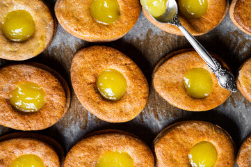 Easter egg shaped cookies pattern. Easter cookies with lemon curd. Traditional easter dessert. Cookies for children. Vegan cookies. Top view.