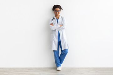 Portrait of black doctor posing with folded arms