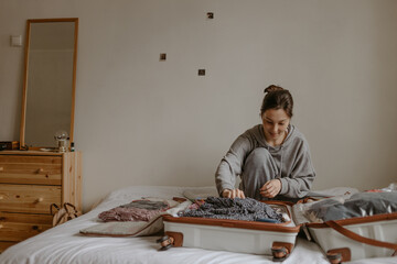 woman with the baggage at home