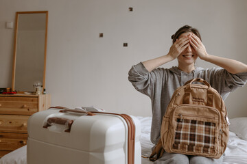 woman with the baggage at home