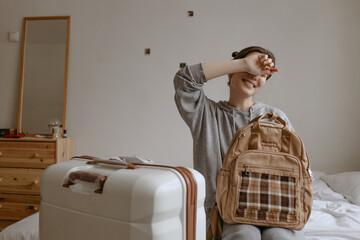 woman with the baggage at home