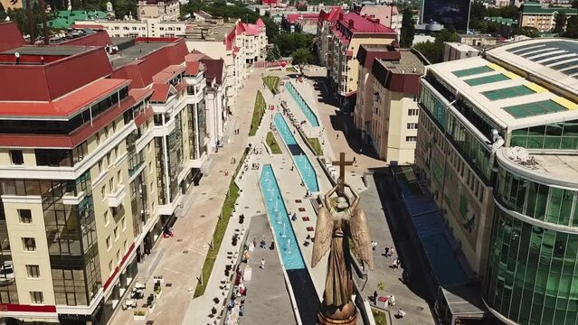 Flight along the city alley with a statue of an angel and paths of fountains - inscription - Alexander Pushkin
