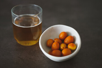 Image of a cold beer along with some olives