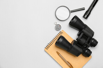 Set of travel items, notebook and pen on white background
