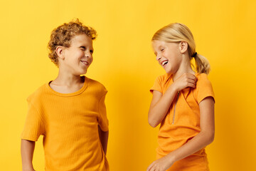 two joyful children casual wear games fun together posing isolated background unaltered