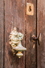 Old wooden door and vintage knocker
