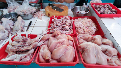 Close up top view of chicken meat on display of stall at traditional market in South Tangerang,...