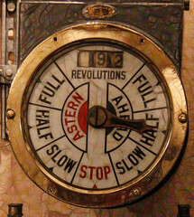 Fototapeta na wymiar ship speed and direction on movement control dial within a brass circular frame