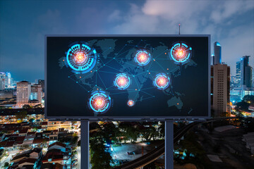 Hologram of Earth planet map on billboard over night panoramic cityscape of Kuala Lumpur, Malaysia, Asia. The concept of international companies in KL. Globe